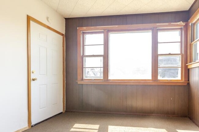Enclosed porch/sunroom with view of back entrance - 4158 N Meade Ave