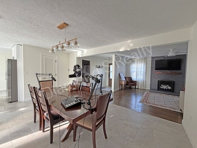 Building Photo - Stunning 3_Bed Home with Two Primary Suites & a Pool!