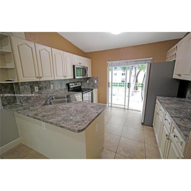 Building Photo - 10953 W Okeechobee Rd