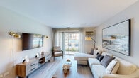 This single-floor residence offers a thoughtfully designed layout with a comfortable and contemporary aesthetic throughout. The living room serves as the heart of the space, featuring light wood-style flooring, neutral walls, and large sliding glass doors that flood the area with natural light and open to a private balcony with direct views of the community pool. The balcony, enclosed by a classic wrought iron railing, provides a relaxing outdoor retreat.

The galley-style kitchen is efficiently organized with white cabinetry, warm countertops, a double-basin sink, and white appliances, offering ample storage and a clean, functional workspace. Adjacent to the kitchen, the dining area is an inviting space accented by light wood-style flooring, floating wall shelves, a circular metal wall decoration, and a chandelier overhead—perfect for everyday meals or entertaining.

The bedrooms are carpeted for comfort and feature natural light through large windows dressed with sheer curtains. Each bedroom includes a closet with bi-fold doors and easy access to the rest of the unit. The bathroom is clean and straightforward, equipped with a tiled tub-shower combination and classic fixtures. Together, the spaces create a cohesive, livable environment with a warm, welcoming ambiance throughout.