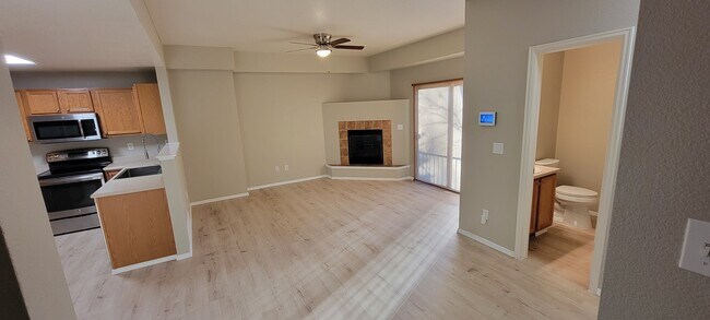 Living Room with new luxury vinyl plank flooring and gas fireplace - 2141 Legacy Ridge Vw