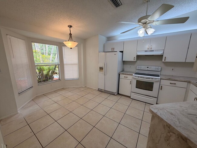 Building Photo - Centrally located 3/2 with 2 car garage. Pet friendly with fenced in backyard. Lawncare included.