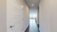 Located at 486 Centerpointe Circle in Altamonte Springs, FL, this well-appointed 2-bedroom, 3-bathroom residence offers a thoughtfully designed single-floor layout with contemporary finishes throughout. Dark hardwood-style flooring flows seamlessly across the main living areas, creating a cohesive and polished aesthetic.

The kitchen is a standout feature, showcasing light wood cabinetry, a white subway tile backsplash, granite countertops, and a central island that provides additional prep and seating space. A full suite of stainless steel appliances — including a refrigerator with ice maker, range, microwave, and dishwasher — completes the modern culinary space.

The open living room benefits from a bank of large windows fitted with horizontal blinds, allowing abundant natural light and outdoor views. A ceiling fan adds comfort to the space.

The primary bedroom is generously sized and includes access to a walk-in closet with wire shelving. The second bedroom also features a window with exterior views and its own closet. Each bathroom is finished with large-format tile flooring, granite vanity countertops, and contemporary fixtures.

A central hallway connects all rooms efficiently, while recessed lighting and a textured ceiling add architectural detail. The overall ambiance is clean, bright, and move-in ready.