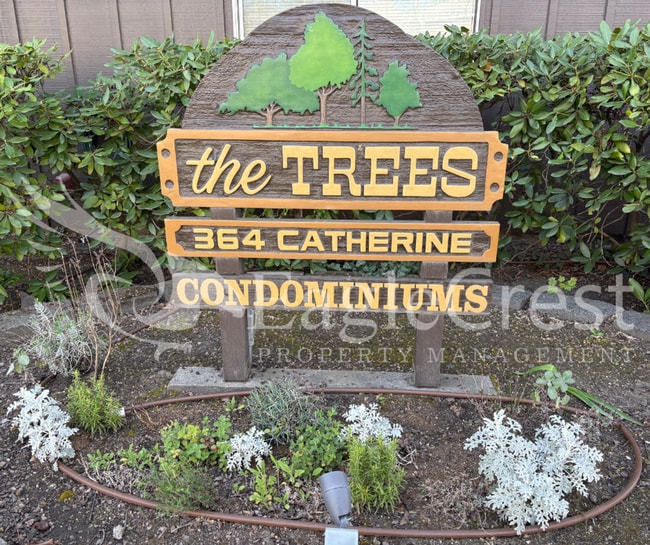 Building Photo - Convenient 3 Bedroom 2 Bathroom Condo Living "In The Trees" with On-Site Amenities
