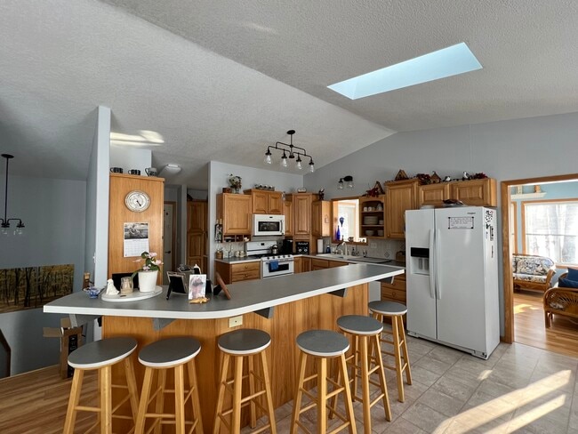 Kitchen with large island, and informal dining - 38079 Dead Lake Rd