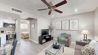 Located at 960 W Southern Ave in Mesa, AZ, this efficiently designed one-bedroom, one-bathroom residence offers a thoughtfully organized single-floor layout. The living room features light wood-look flooring, neutral gray walls, a textured ceiling, and a ceiling fan, creating a comfortable and inviting atmosphere. A window with blinds allows natural light to fill the space, while an open sightline connects the living area to the kitchen, which is equipped with white cabinetry, stainless steel appliances, and light countertops. The bedroom is a cozy retreat with its own ceiling fan, a window that brings in natural light, and the same wood-look flooring found throughout. A door from the bedroom provides convenient access to the closet and bathroom. The bathroom is fitted with a full tub and shower combination, accented by a soft sage-green curtain and clean white surround. Throughout the unit, the consistent use of light, neutral tones and wood-look flooring creates a cohesive and calming aesthetic. This well-maintained Mesa residence offers a practical and comfortable living space ideal for those seeking a streamlined, easy-to-maintain home.