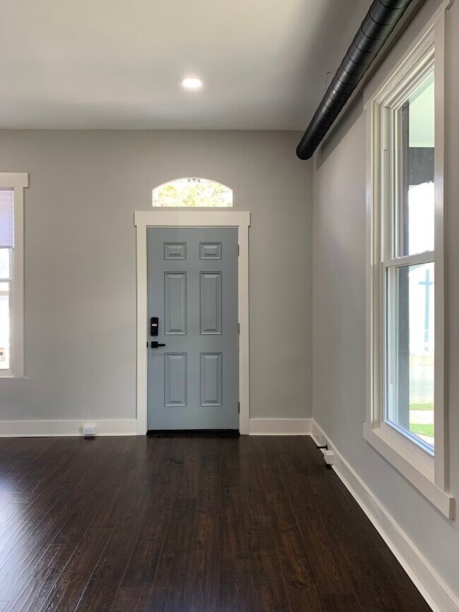 Private and solid steel doors at both the front and side entry ways. - 1217 Wheeler St