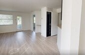 This contemporary 860 square foot apartment in Boca Raton offers a blend of comfort and style. The space features two bedrooms, including a primary bedroom of 150 square feet, and two full bathrooms. The open-concept living area seamlessly connects to a modern kitchen, showcasing dark cabinetry, stainless steel appliances, and granite countertops. 

The bathrooms are thoughtfully designed with updated vanities, granite countertops, and tiled shower/tub combinations. Throughout the apartment, you'll find a mix of carpeting in the bedrooms and wood-look flooring in the main living areas, adding warmth and easy maintenance. 

Large windows in each room allow ample natural light, while ceiling fans provide additional comfort. The bedrooms feature spacious closets for storage. The overall neutral color palette creates a bright, airy ambiance, allowing for personalization. Located at 5515 Pacific Blvd in Boca Raton, this single-story apartment offers a perfect blend of location and modern living.