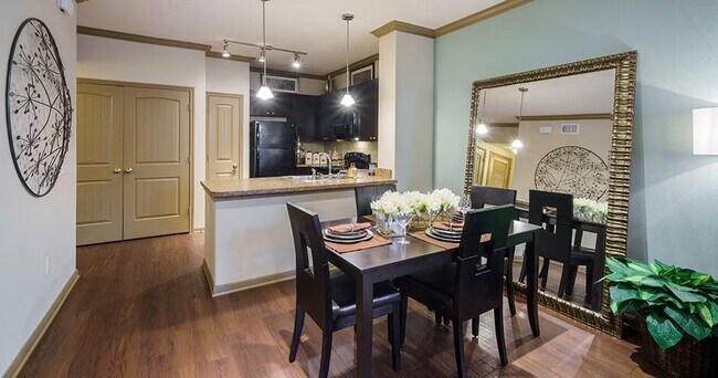 Building Photo - Spacious Living with Urban Convenience!