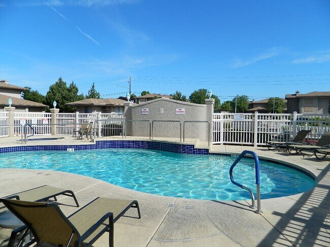 Building Photo - Charming, furnished, ground floor Condo with attached garage, pool and amenities