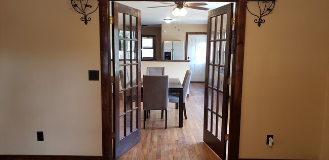 Living room view to dining room and kitchen - 87 Woodlawn St