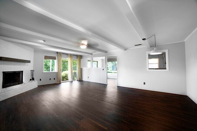 Oversized living area includes space for dining with a kitchen pass-through window - 716 Putter Dr