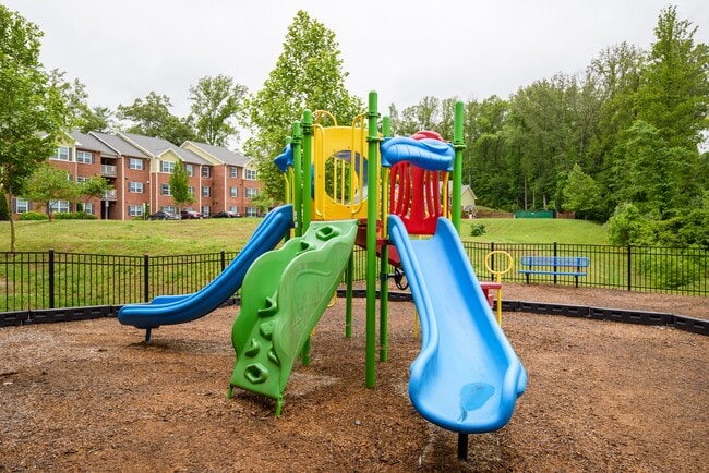 Let imaginations run free at our colorful playground—an inviting space for fun, adventure, and active play. - Timberland Park