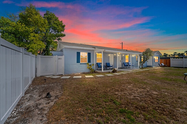 Front porch with porch chairs/table included to enjoy the fenced in backyard - 401 S Mars Ave House