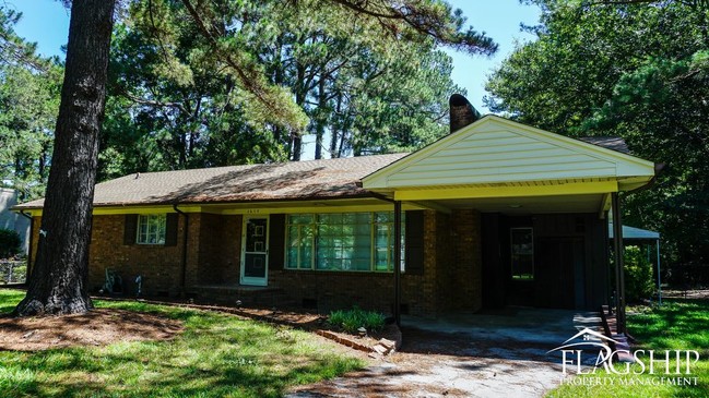 Building Photo - Cute Brick Ranch With Sunroom  Carport