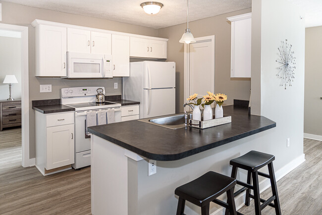 Typical Apartment Kitchen with Dishwasher, Pantry, & Breakfast Bar - Green Wood Park Townhouses & Apartments