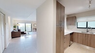 Located at 800 S Dixie Hwy in the heart of Coral Gables, FL, this well-appointed 3-bedroom, 2-bathroom residence offers a clean, modern aesthetic across a thoughtfully designed single-floor layout. The open-plan living and dining area is bright and airy, featuring large-format tile flooring and sliding glass doors that lead to a private balcony with lush tropical views. The space flows naturally into a well-equipped kitchen, highlighted by wood-toned cabinetry, crisp white countertops, an undermount stainless steel sink, and a dishwasher — all finished with a contemporary, functional style. The primary bedroom is generously sized, benefiting from natural light through a large window overlooking the surrounding greenery. A second bedroom offers dual-bed flexibility, a ceiling fan, and its own sliding door access to an outdoor balcony, making it ideal for guests. The third bedroom is a quiet, cozy retreat with a window view. The two bathrooms are cleanly finished — one featuring a walk-in shower and wood-toned vanity, the other a full bathtub with glass enclosure. A dedicated closet provides practical storage, completing this well-organized and stylish Coral Gables residence.