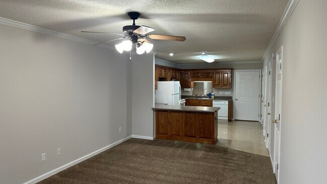 View of living room back into kitchen. - 1211 Goldridge Dr SW