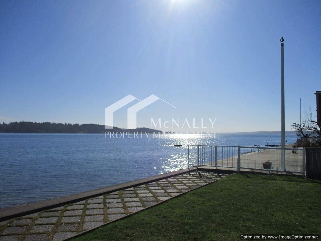 Primary Photo - UNIQUE ARTIST-DESIGNED LOW-BANK WATERFRONT...