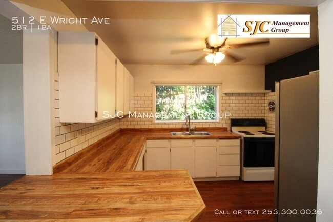 Building Photo - Duplex for rent in Tacoma.