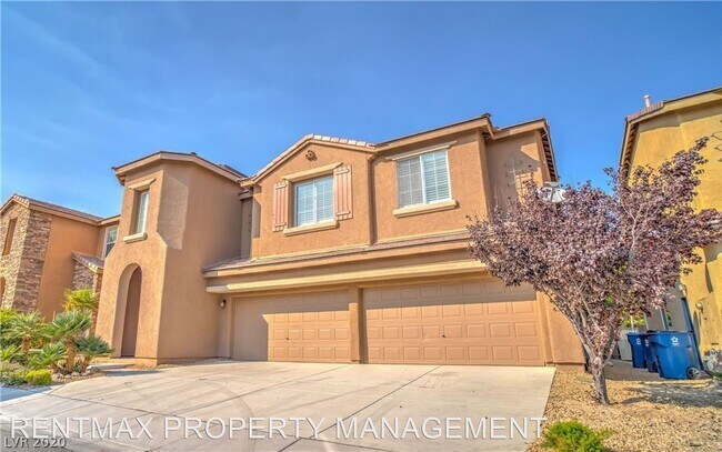 Building Photo - 5 br, 4.5 bath House - 9228 DESERT HEAT AVE