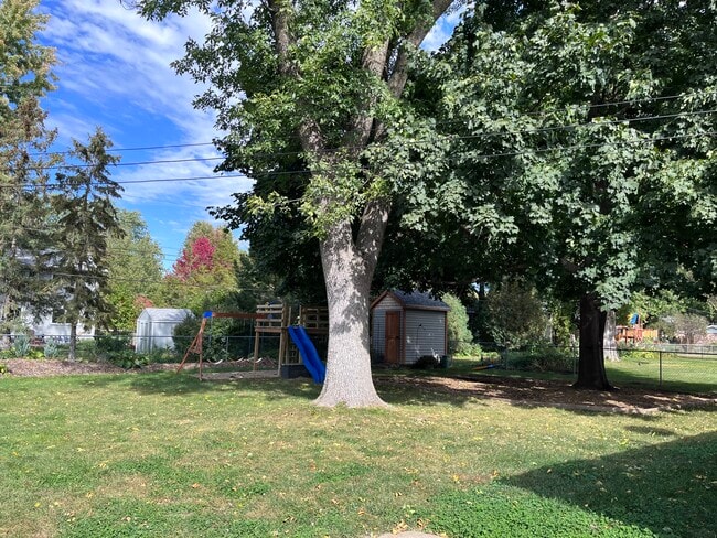 Backyard with swing set and shed - 2000 Sibley Ct