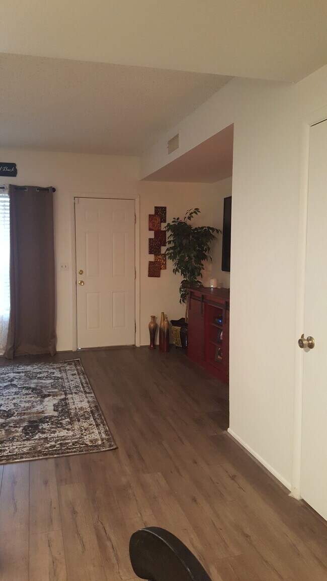 Looking at right side of living area from dining (decor not included) - 7801 N 44th Dr