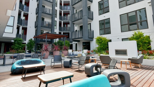 Stunning outdoor terrace with lounge seating and outdoor kitchen - Modera San Pedro Square