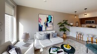 Located at 224 Alexander St in Rochester's vibrant East End neighborhood, this single-floor residence offers a thoughtfully designed open-concept layout with clean, contemporary finishes throughout. Light-toned hardwood flooring runs seamlessly across the living spaces, lending warmth and visual continuity to every room.

The kitchen is a functional and stylish centerpiece, featuring rich wood cabinetry, light stone countertops, a stainless steel appliance suite, and an integrated dishwasher. A row of pendant lights overhead adds a modern, inviting ambiance, while the open design connects effortlessly to the living area.

The living room is bright and welcoming, with neutral walls and generous natural light that highlight the space's clean lines and comfortable proportions. It flows naturally from the kitchen, making it ideal for everyday living and entertaining.

The bedrooms are calm and well-proportioned, each with light wood flooring, neutral wall tones, and natural light from well-positioned windows. The primary bedroom features a private en-suite bathroom for added convenience.

The bathroom is finished with large-format tile flooring, a spacious walk-in shower, a wood-framed vanity mirror, and a clean, minimalist aesthetic that complements the rest of the residence. Overall, this space delivers a polished, modern living experience in a prime Rochester location.