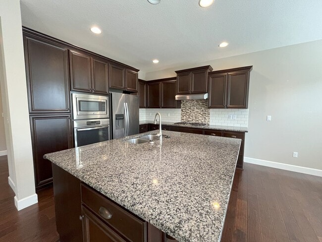 Building Photo - Spacious 4-Bedroom + Bonus Room with Modern Kitchen, Solar Panels & Private Fenced Backyard!