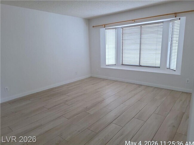 Building Photo - The Lakes Home with No Carpet, Fireplace & Covered Patio