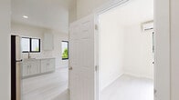 Located at 425 SW Sixth St in Miami's dynamic Brickell neighborhood, this efficiently designed one-bedroom, one-bathroom unit offers a clean, modern aesthetic throughout its single floor. The open layout maximizes every square foot, creating a functional and comfortable living environment.

The kitchen is a standout feature, outfitted with crisp white shaker cabinetry extending to the ceiling, light quartz countertops, a stainless steel undermount sink, and a full suite of stainless steel appliances including a gas range, built-in microwave, and refrigerator. A black-framed window above the sink brings in natural light and adds a contemporary contrast to the all-white palette. Light-toned vinyl plank flooring runs throughout, lending a clean and cohesive look.

The bedroom is a well-proportioned space featuring a sliding black-framed window that overlooks the neighborhood, providing natural light and ventilation. Two sets of louvered bifold closet doors offer generous storage, and a wall-mounted mini-split unit ensures individualized climate control.

The bathroom is finished with elegant marble-look tile on both the floor and full tub surround, complemented by a white vanity with brushed gold hardware and polished chrome fixtures. The overall ambiance of the unit is bright, clean, and move-in ready, reflecting a fresh and contemporary design sensibility.