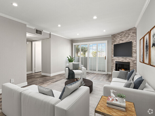 Hardwood floored living room with stone accented fireplace. - Magnolia Terrace