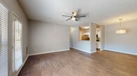 This renovated two-bedroom, two-bathroom unit at 3400 Jenkins Rd in Chattanooga, TN offers a well-designed single-level layout with modern finishes throughout. The open-concept living and dining area features rich hardwood-style flooring, neutral gray walls, and a ceiling fan, creating a comfortable and airy atmosphere. A door leads out to a private outdoor area, while large windows allow natural light to fill the space with views of surrounding greenery.

The galley-style kitchen is thoughtfully updated with white shaker cabinets, granite-look countertops, a stainless steel refrigerator, dishwasher, microwave, and range, along with a sleek undermount sink — offering both style and functionality.

The dining area is defined by a contemporary pendant light fixture and continues the cohesive hardwood-style flooring. Both bedrooms are carpeted for comfort, each equipped with a ceiling fan and ample natural light. The spacious primary bedroom includes a walk-in closet outfitted with wire shelving. The bathrooms feature wood-style flooring, white vanities with granite-look countertops, and clean, modern fixtures. Two closets provide generous storage throughout the unit.