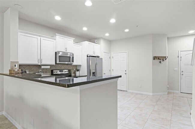 Building Photo - Beautiful 3/2.5 Spacious Townhome with 1 Car Garage in the Gated Community of Jackson Park - Orla...