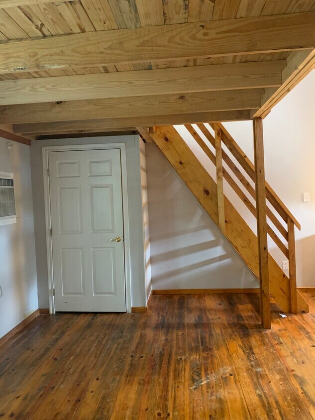 Closet in living room with stairs to loft - 1112 Cardinal St #105
