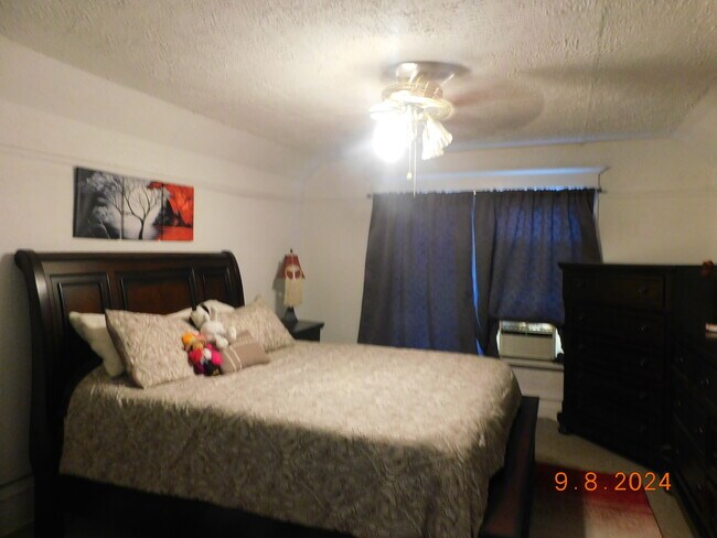 Large bedroom with walk-in closet - 3428 Wisconsin Ave Apartments