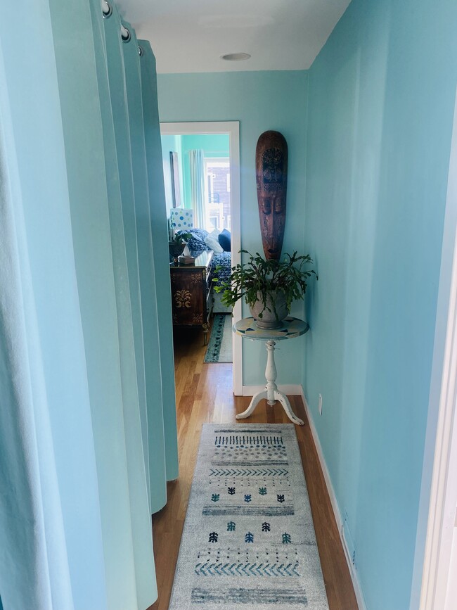 Hallway with washer/dryer to the left behind curtins - 56 Harbour Close