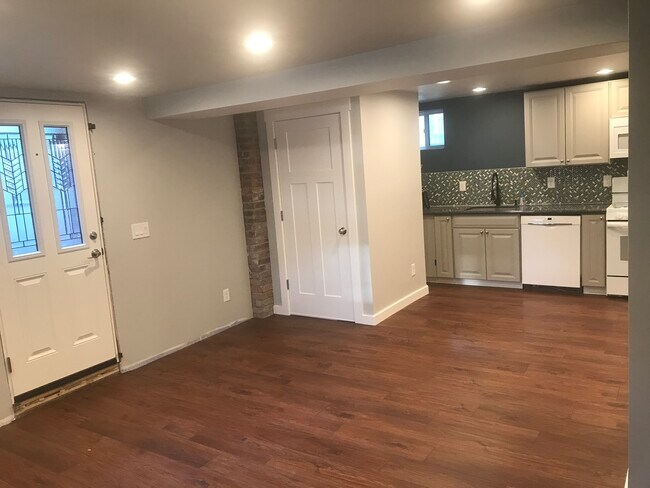 Another view of the kitchen area. There are now floating shelves above the sink. - 2102 S 8th St