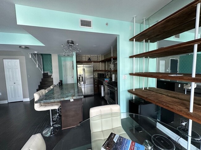 Building Photo - Modern 2-Bedroom Condo with Premium Amenit...