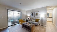 This thoughtfully designed one-bedroom, one-bathroom residence in Hayward, California offers a comfortable and functional single-floor layout. Light wood-style flooring flows throughout, creating a cohesive and airy feel across all rooms.

The living room is the heart of the home, featuring a sliding glass door that opens to a private balcony, allowing natural light to fill the space and providing pleasant outdoor views. The open layout connects seamlessly to the dining area, which includes a ceiling fan and is large enough to accommodate a round glass dining table.

The galley-style kitchen is efficiently designed with white shaker cabinetry, dark countertops, stainless steel appliances including a refrigerator and dishwasher, an undermount sink, and open shelving for additional storage.

The bedroom is a quiet retreat featuring a large window with blinds that invites natural light, a built-in closet with sliding doors offering ample storage, and a baseboard heating unit.

The bathroom features a wide vanity with white cabinetry, a dark countertop, a large mirror with overhead lighting, and a full shower-tub combination. Clean, neutral finishes throughout give the space a fresh and modern character well-suited for comfortable everyday living.