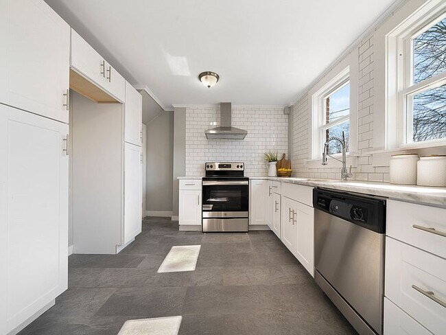 Newly remodeled Kitchen with basement door to the left - 231 Raleigh Way