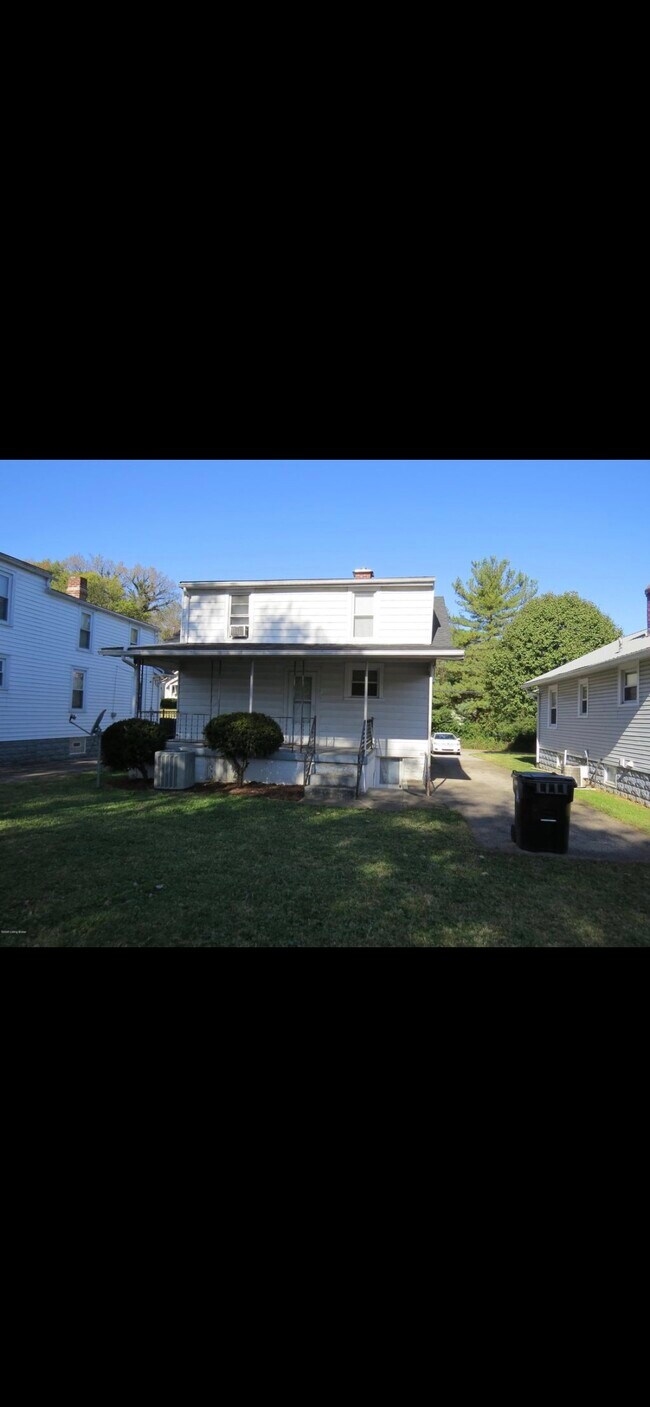 Large flat backyard with plenty of space to relax on the back covered porch. - 1564 McKay Ave