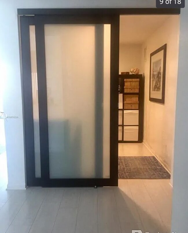 Den - 19390 Collins Ave