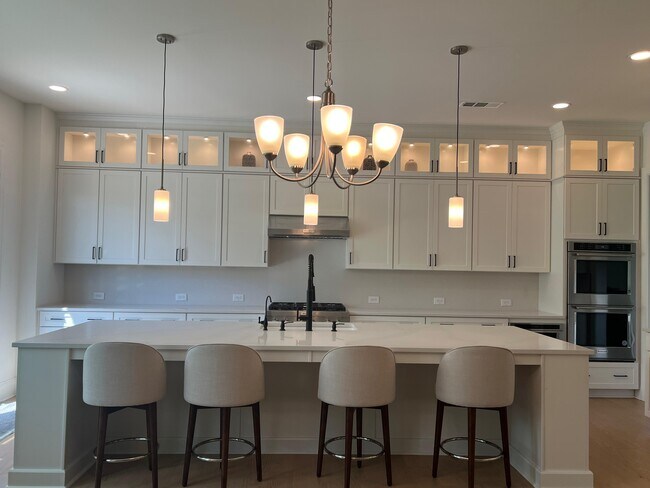 luxury kitchen with to the ceiling cabinets - 6490 Pond View Dr