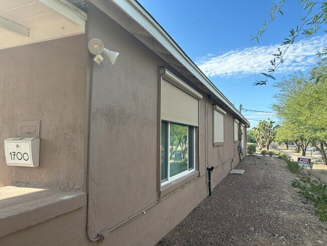 Remote controlled shades - 1700 E 7th St