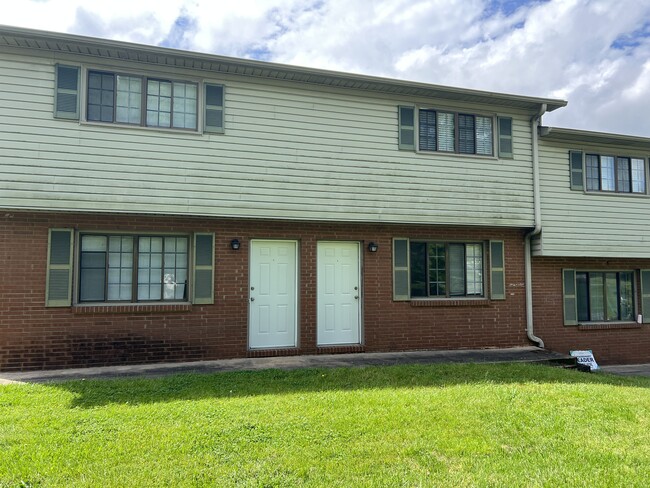 Front of the building with porch to sit outside - 503 Shue Rd