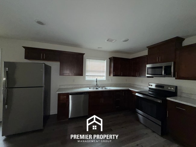 Building Photo - Modern 4BR/2BA Tuscaloosa Home | Stainless Steel Appliances, Hardwood Floors & Covered Patio