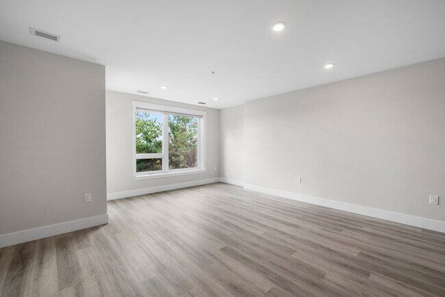 Photo du bâtiment - 1 Bedroom + Den Elation Suites - Plan C