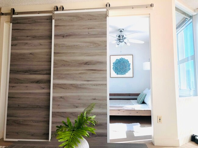 Contemporary Barn door to Guest bedroom - 801 S King St Apartment